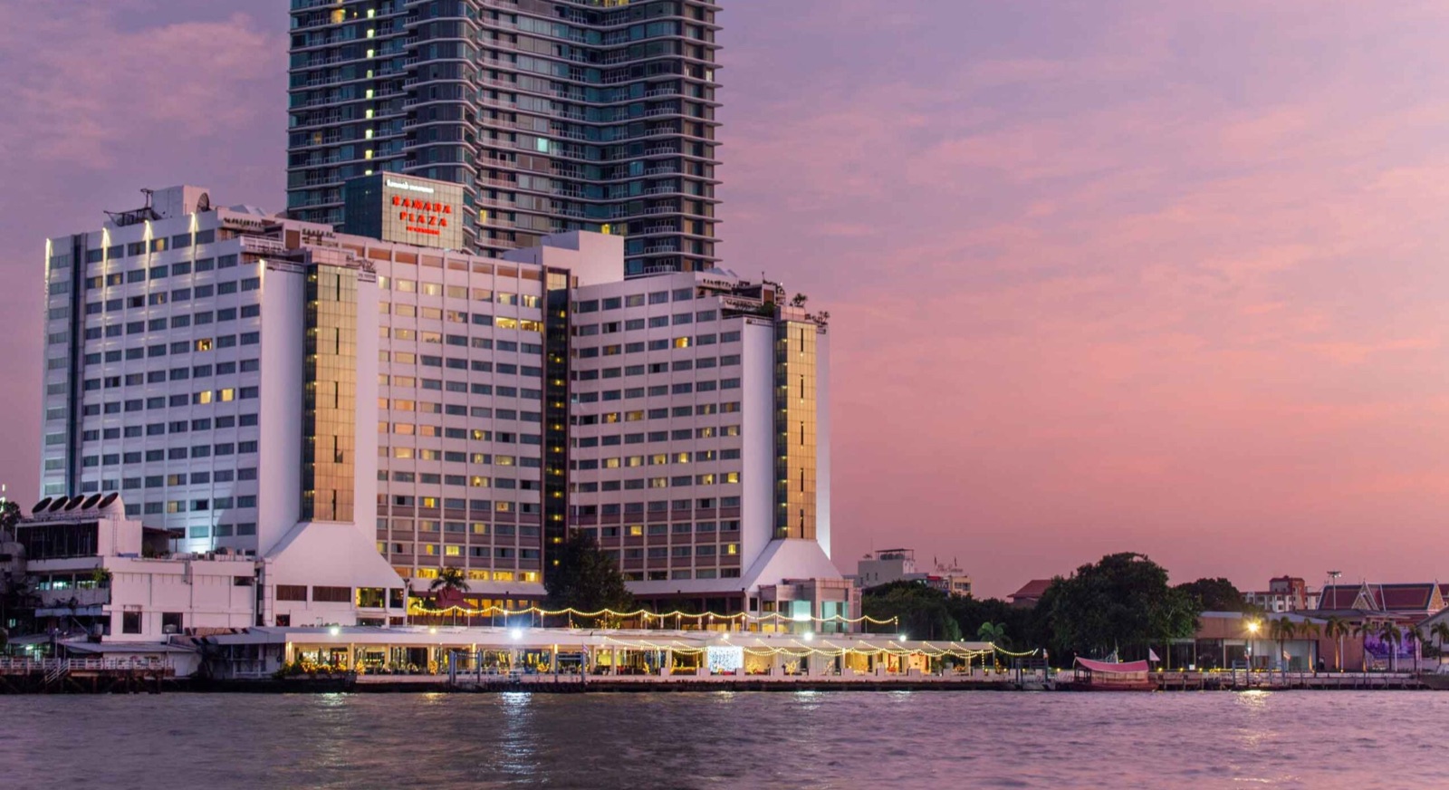 Ramada Plaza by Wyndham Bangkok Menam Riverside on the Chao Phraya River at sunset